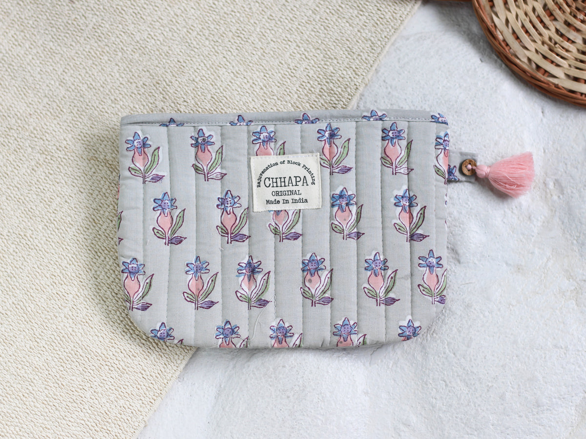PINK FLOWER IN GRAY POUCH