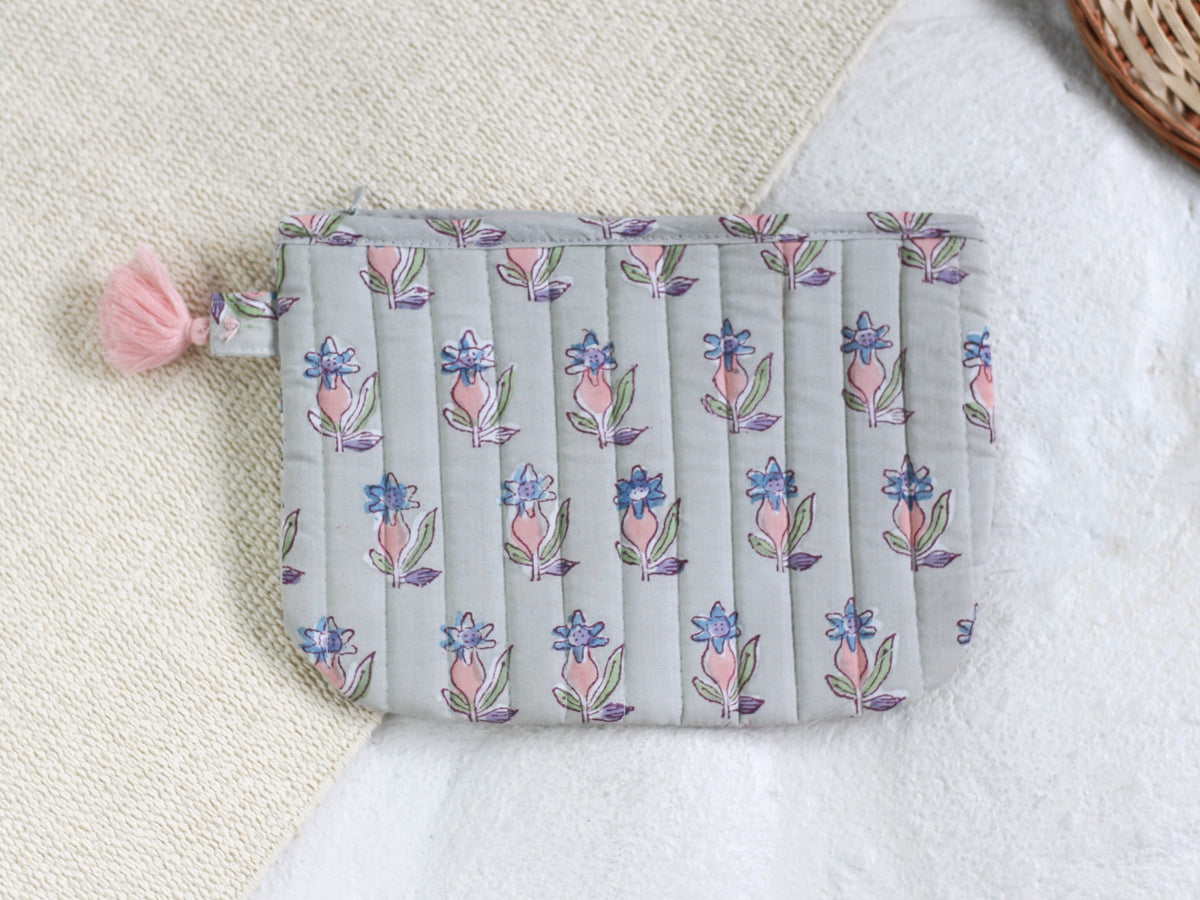 PINK FLOWER IN GRAY POUCH