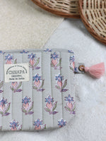 PINK FLOWER IN GRAY POUCH